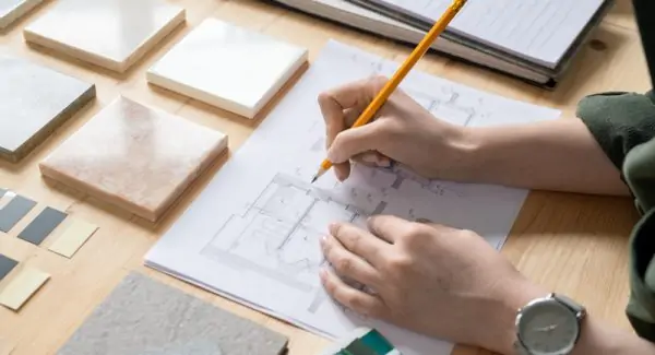 hands of young female designer of interior with pe EQK96GP 1